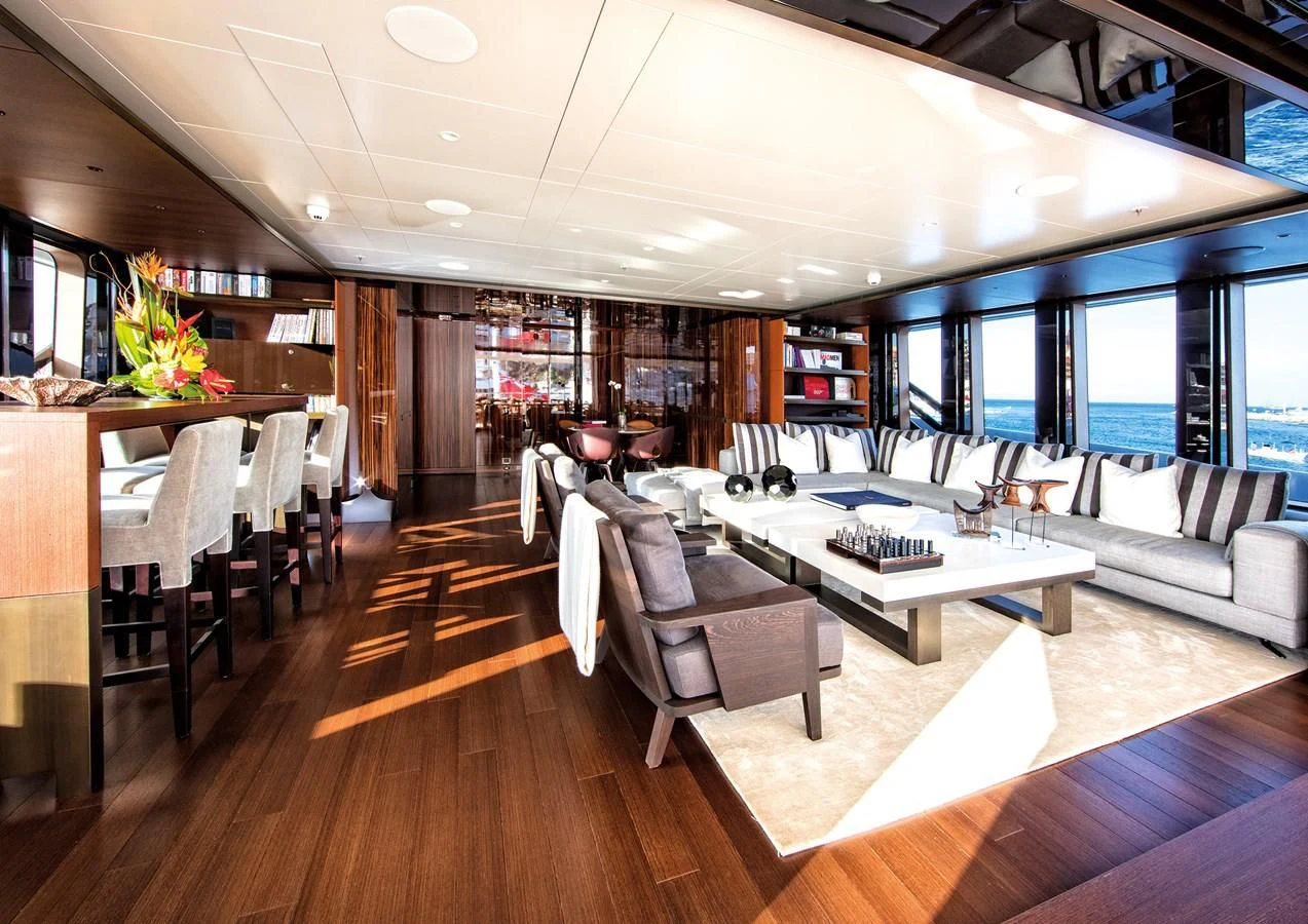 a room with a couch and a table and chairs aboard HALO Yacht for Charter