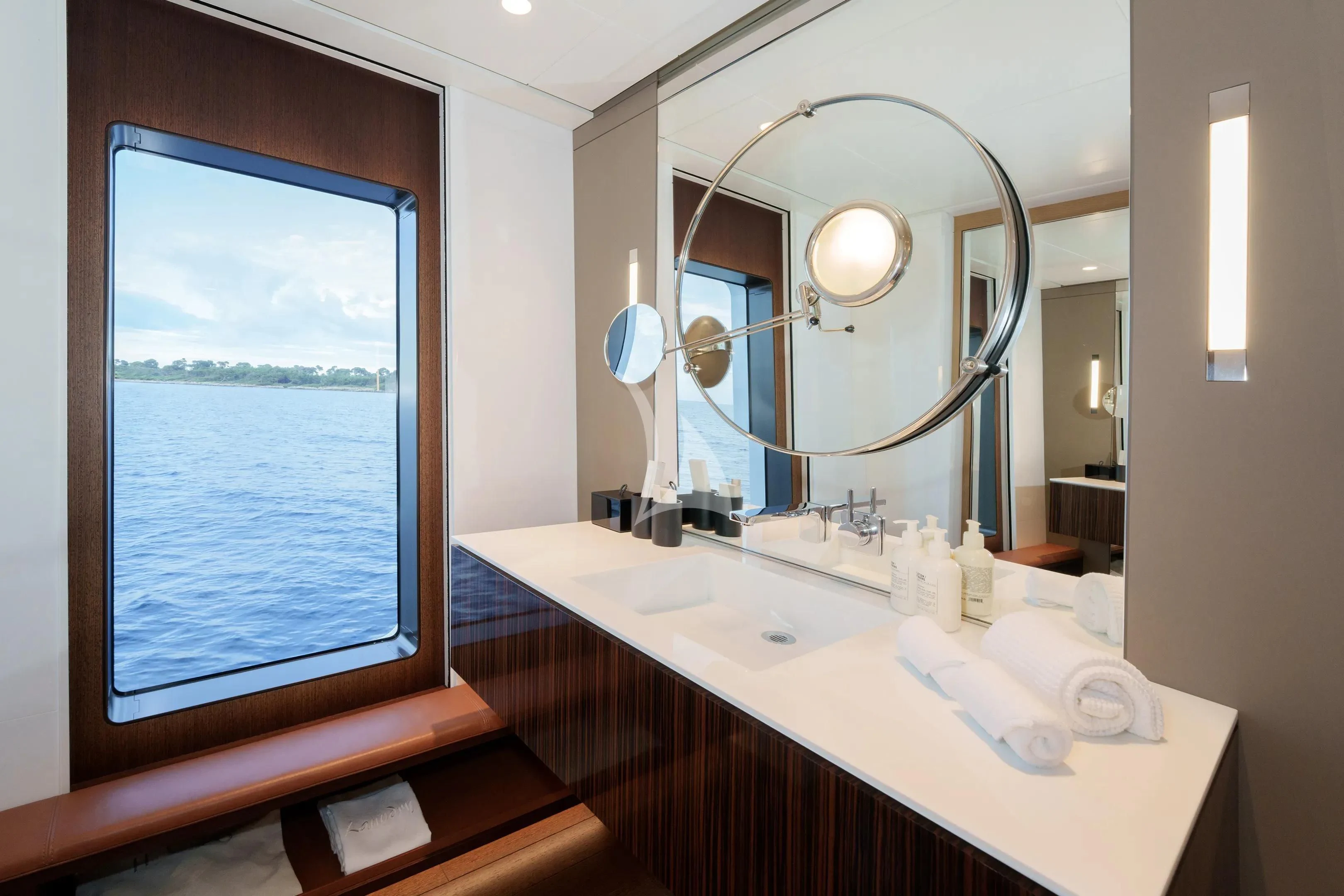 a bathroom with a large mirror aboard HALO Yacht for Charter