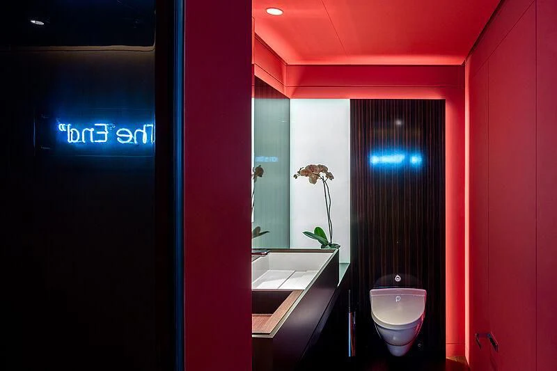 a bathroom with red walls aboard HALO Yacht for Charter