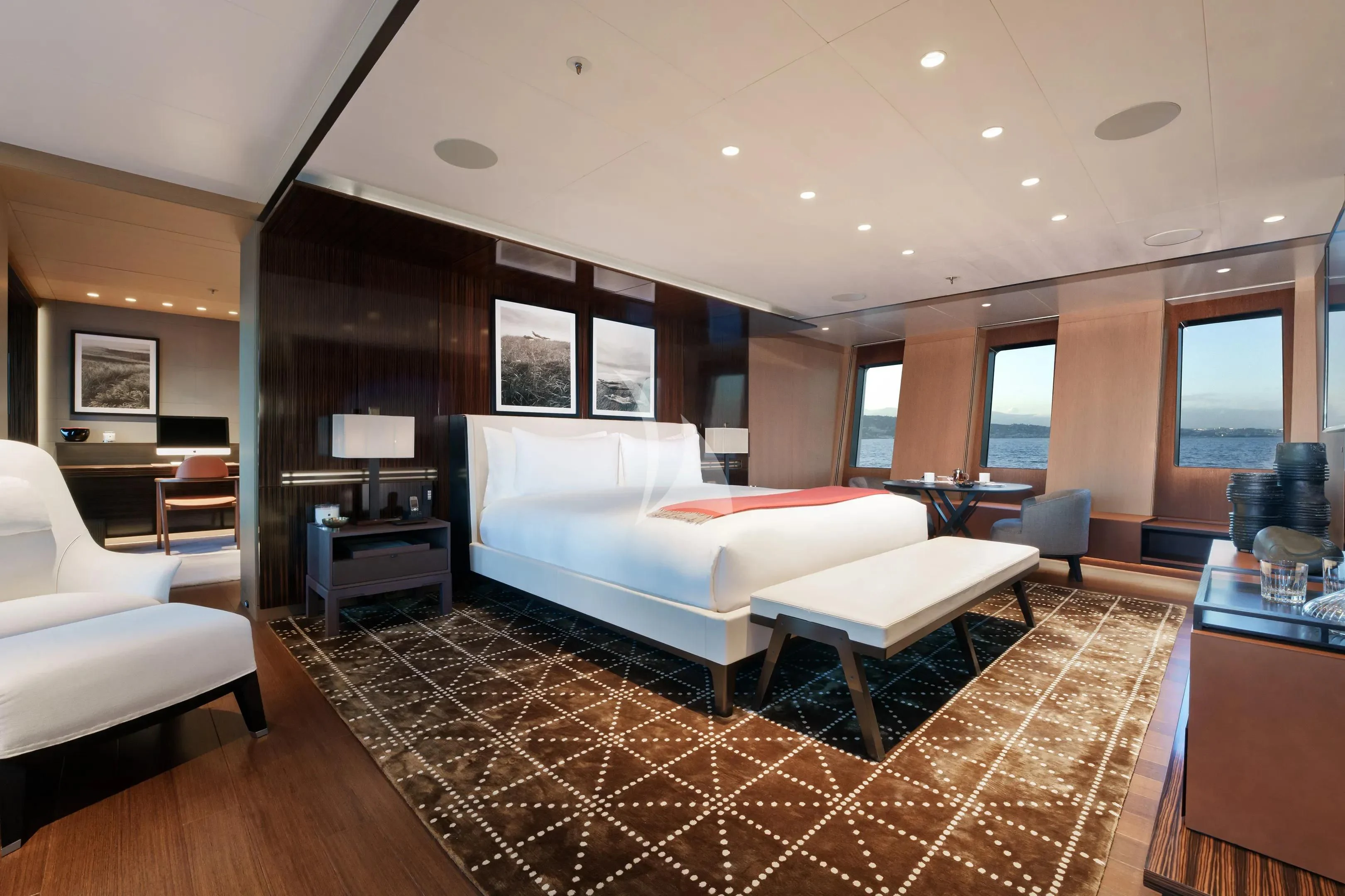 a large bedroom with a large bed aboard HALO Yacht for Charter