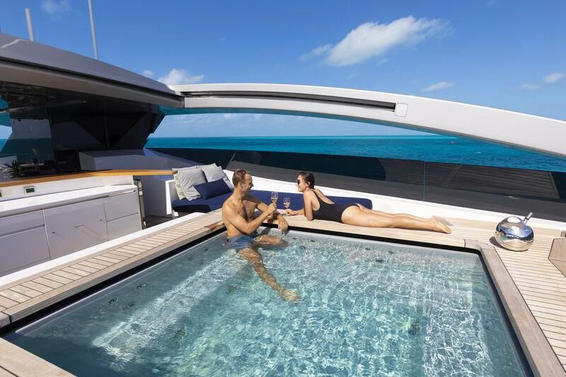 a group of people on a trampoline aboard HALO Yacht for Charter