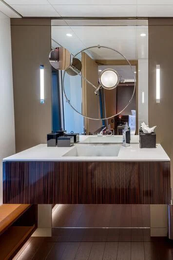 a bathroom with a large mirror aboard HALO Yacht for Charter