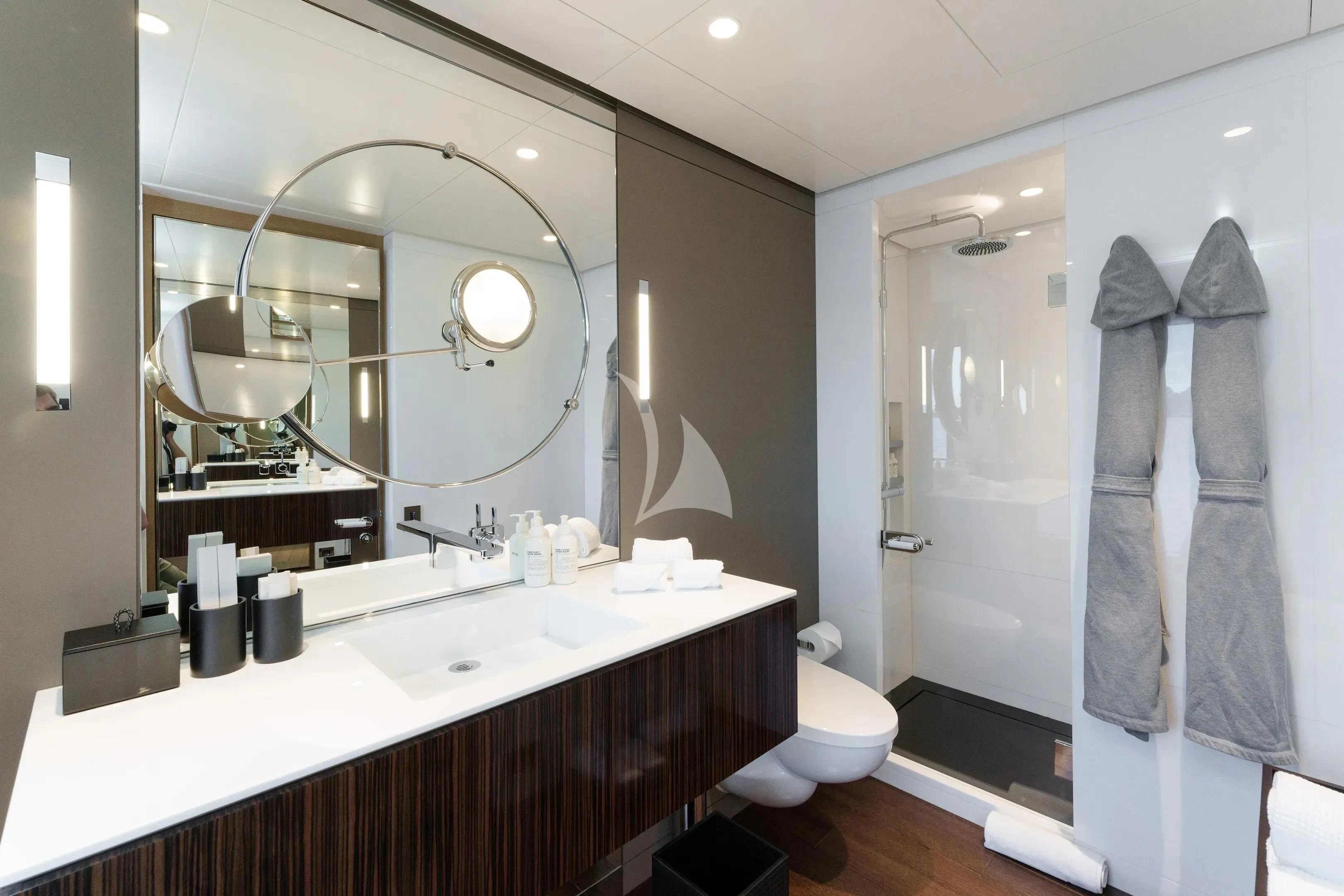 a bathroom with a large mirror aboard HALO Yacht for Charter