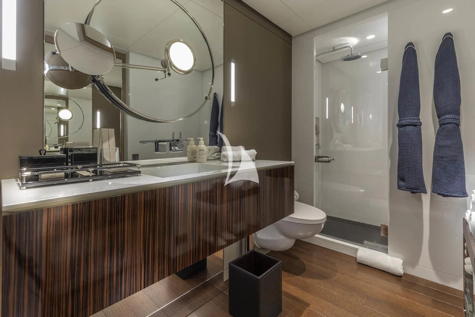 a bathroom with a large mirror aboard HALO Yacht for Charter