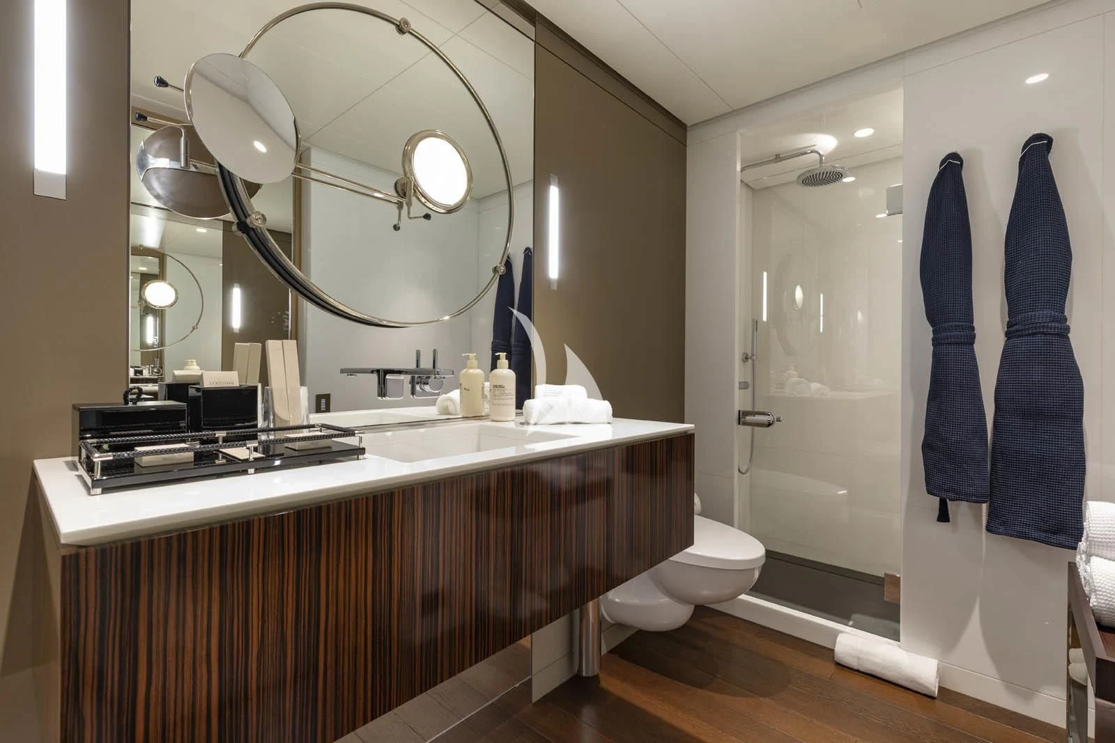 a bathroom with a large mirror aboard HALO Yacht for Charter