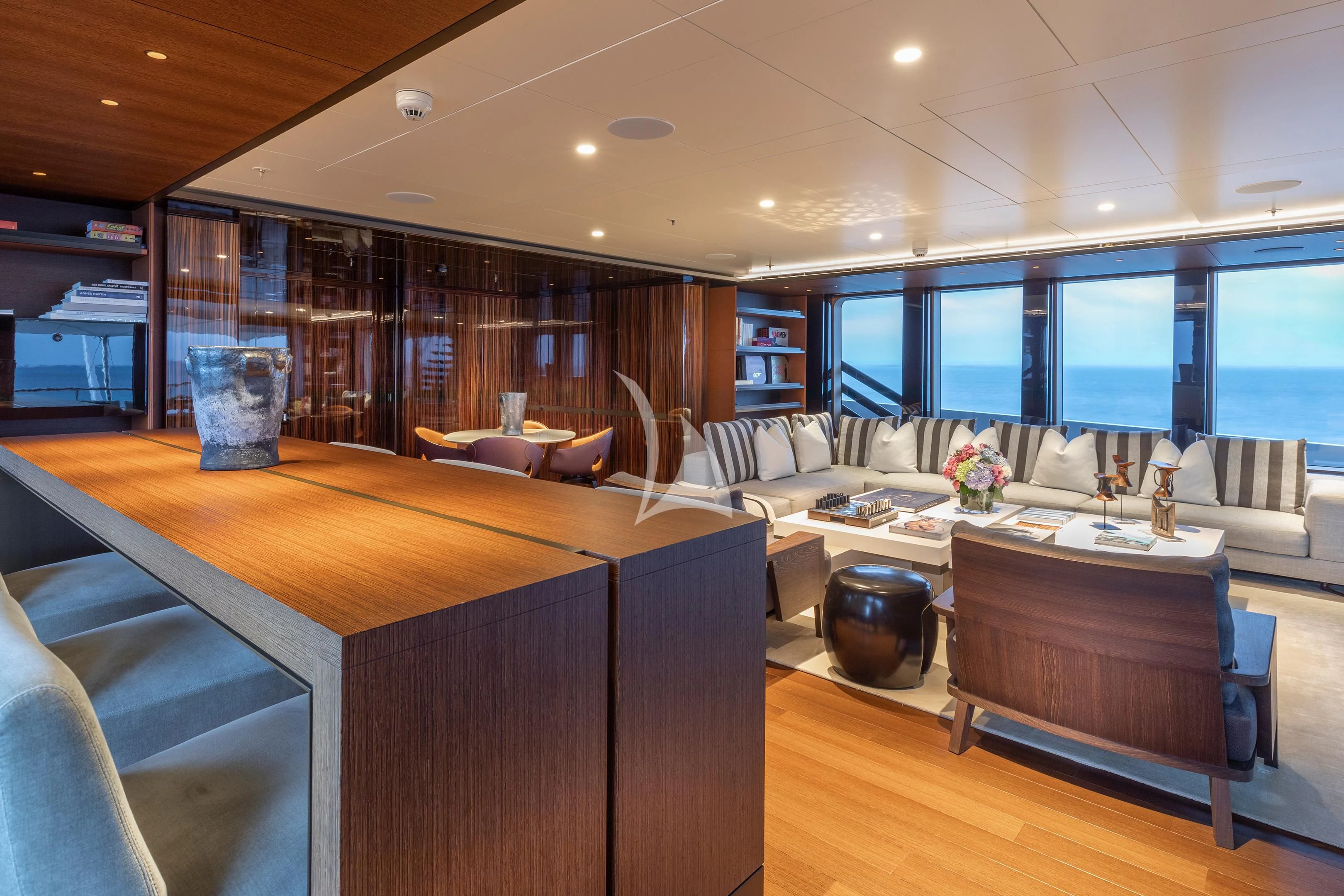 a room with a couch and a table aboard HALO Yacht for Charter