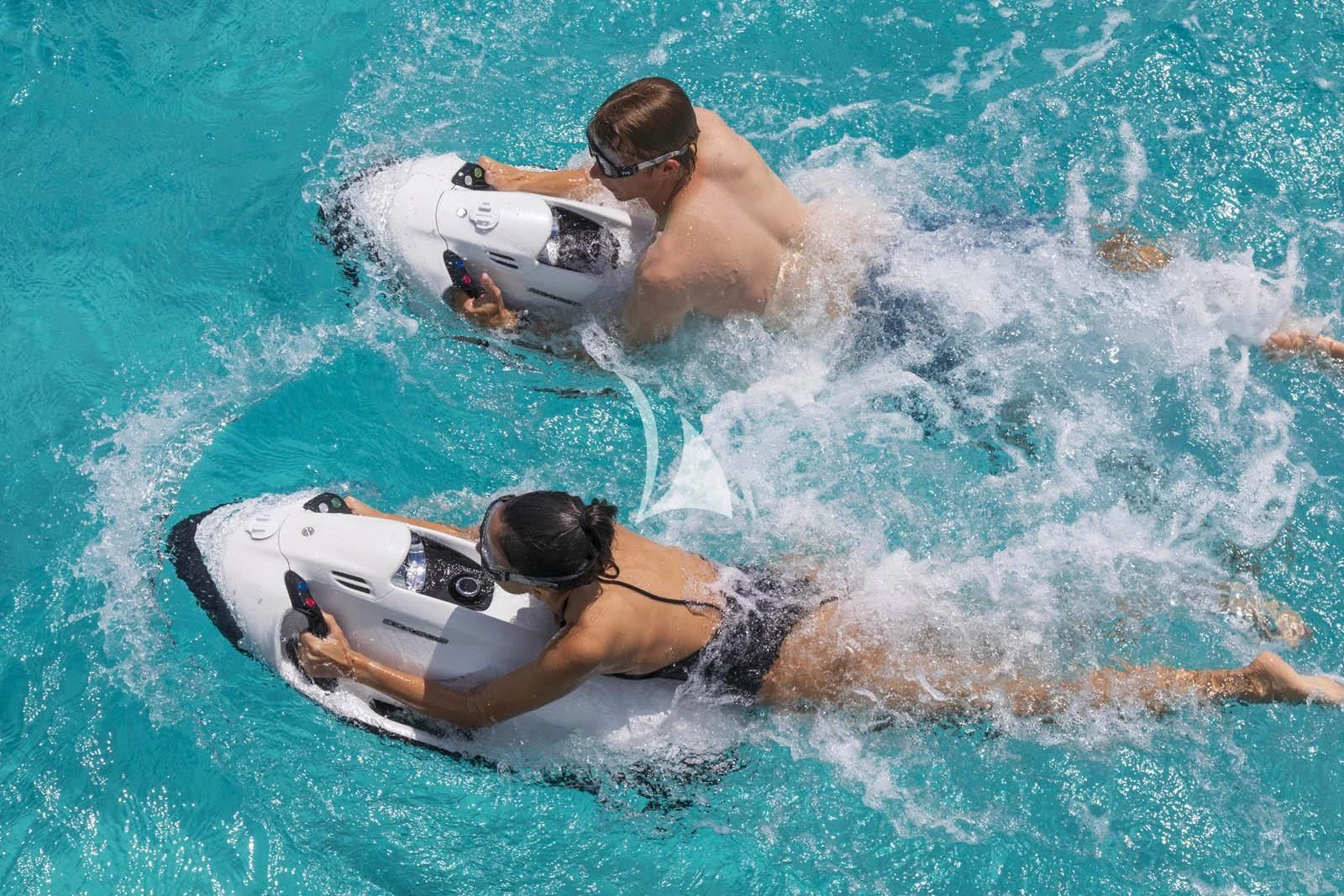 a man and a woman in the water aboard HALO Yacht for Charter