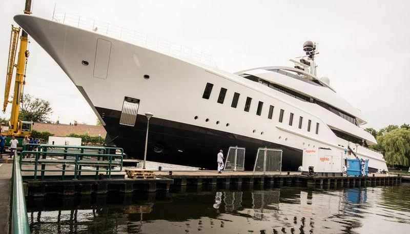 a large boat docked at a dock aboard HALO Yacht for Charter