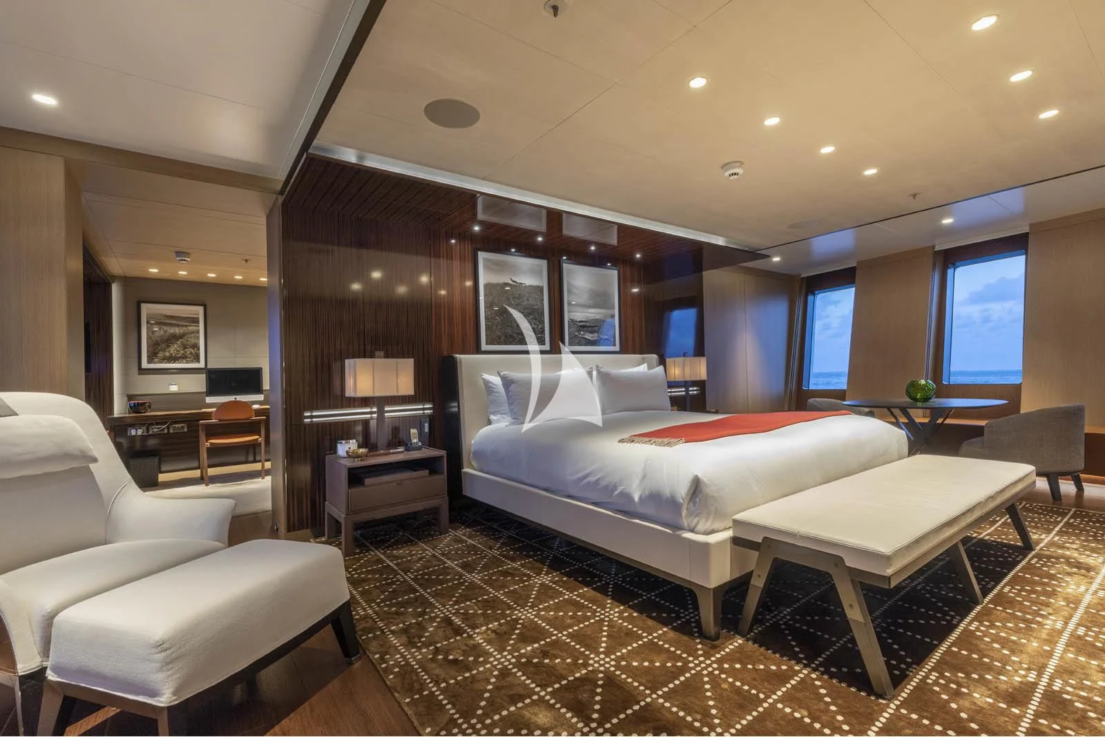 a large hotel room with a bed aboard HALO Yacht for Charter