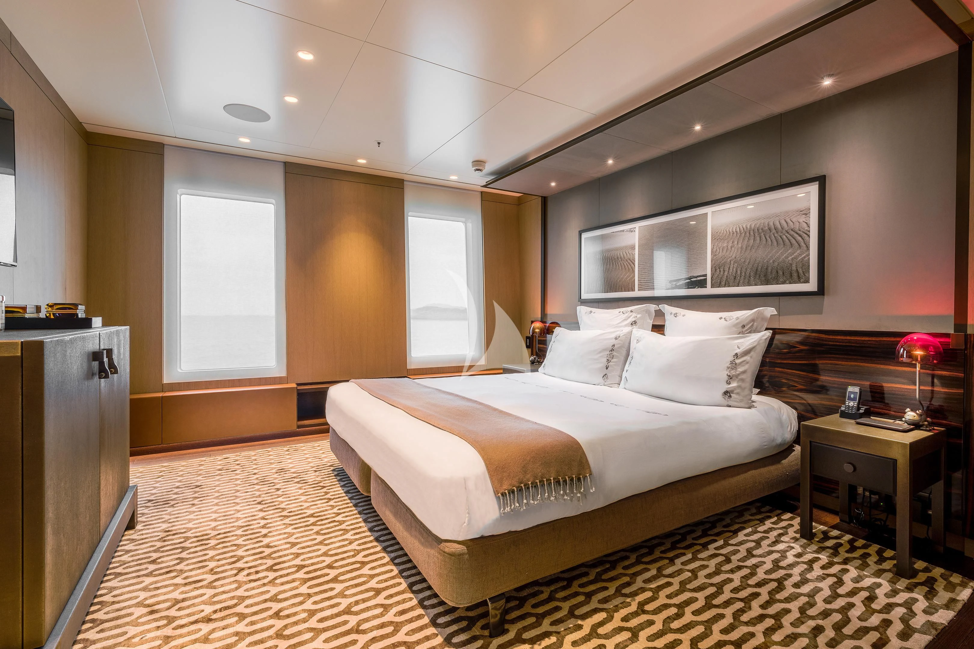 a large bedroom with a large bed aboard HALO Yacht for Charter