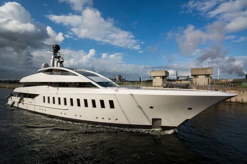 a white yacht docked at a pier aboard HALO Yacht for Charter