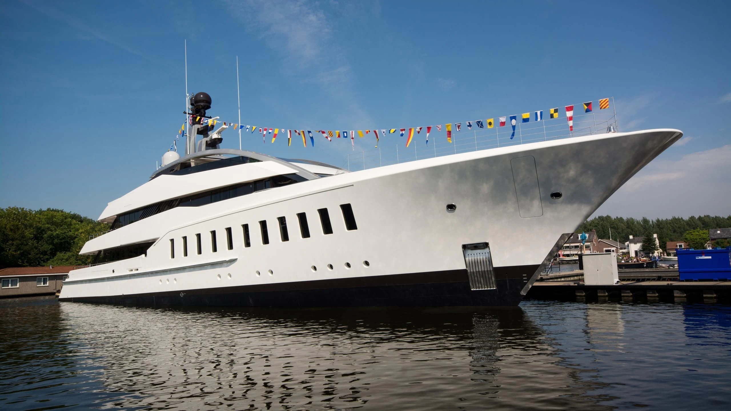 a large boat with colorful flags aboard HALO Yacht for Charter