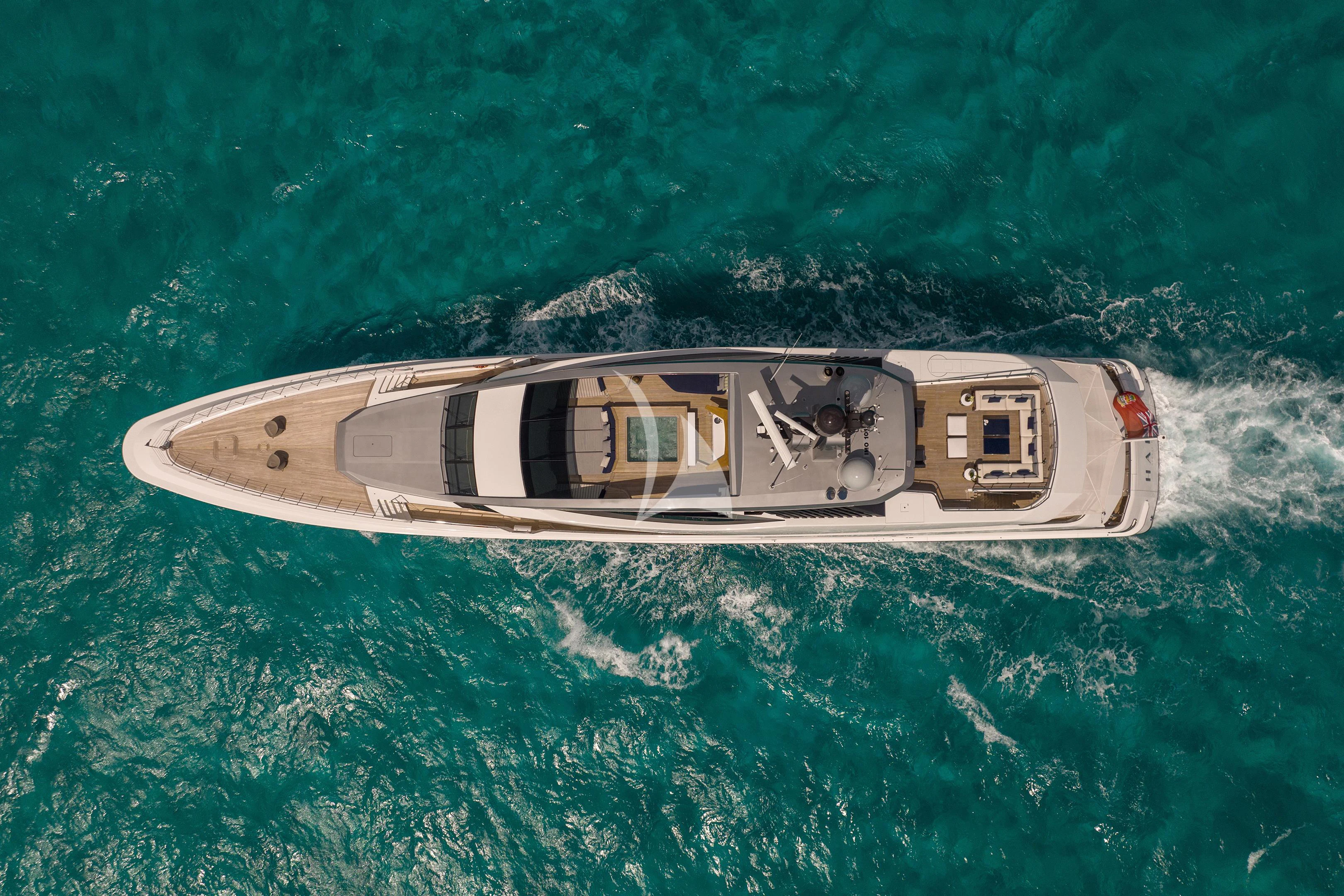 a helicopter flying over a body of water aboard HALO Yacht for Charter