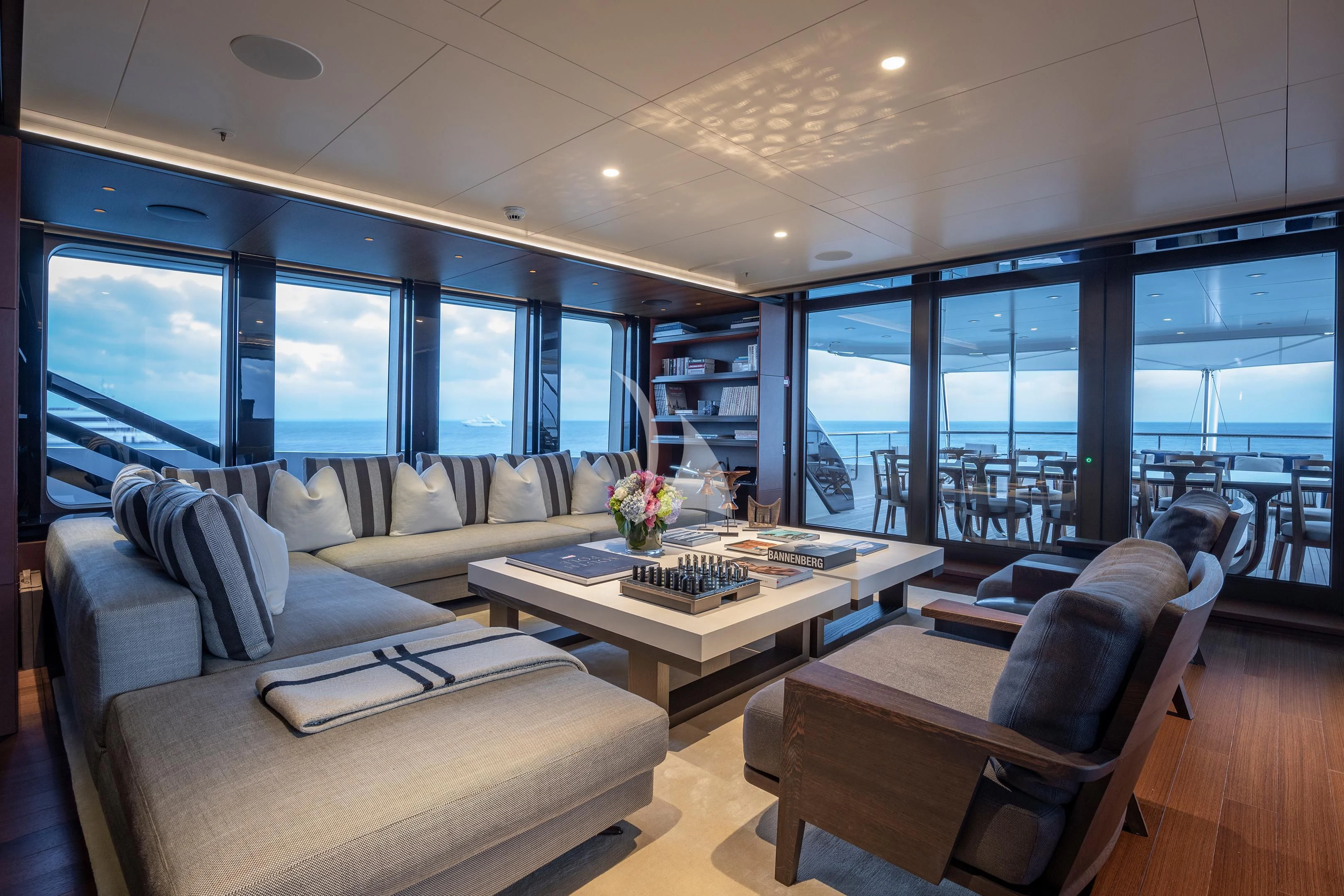 a living room with a large window aboard HALO Yacht for Charter