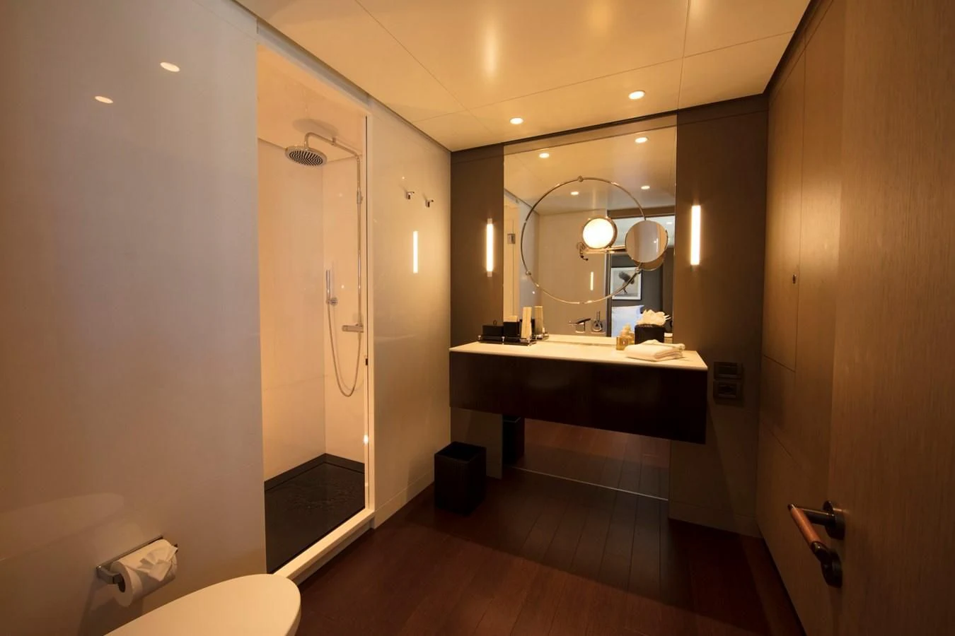 a bathroom with a large mirror aboard HALO Yacht for Charter