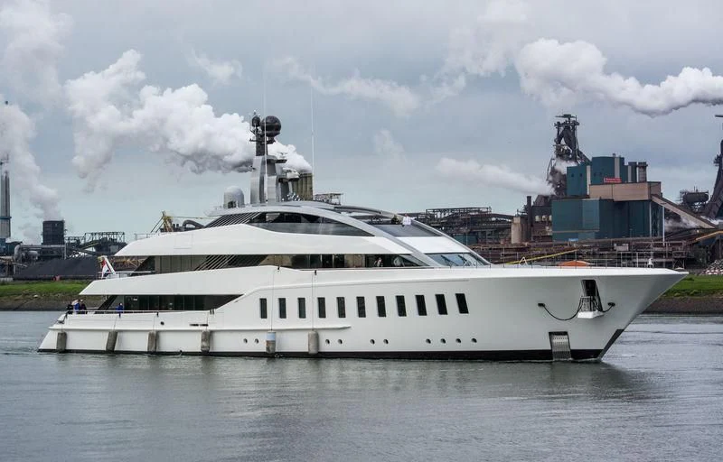 a large white boat in a harbor aboard HALO Yacht for Charter