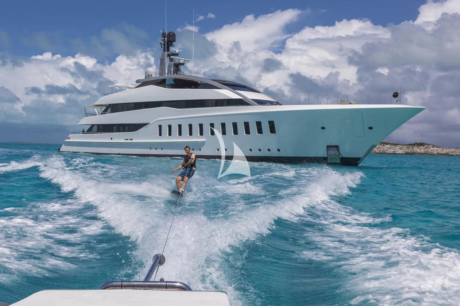a man water skiing aboard HALO Yacht for Charter