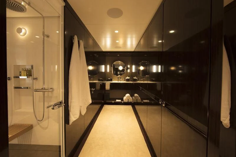 a bathroom with a large shower unit aboard HALO Yacht for Charter