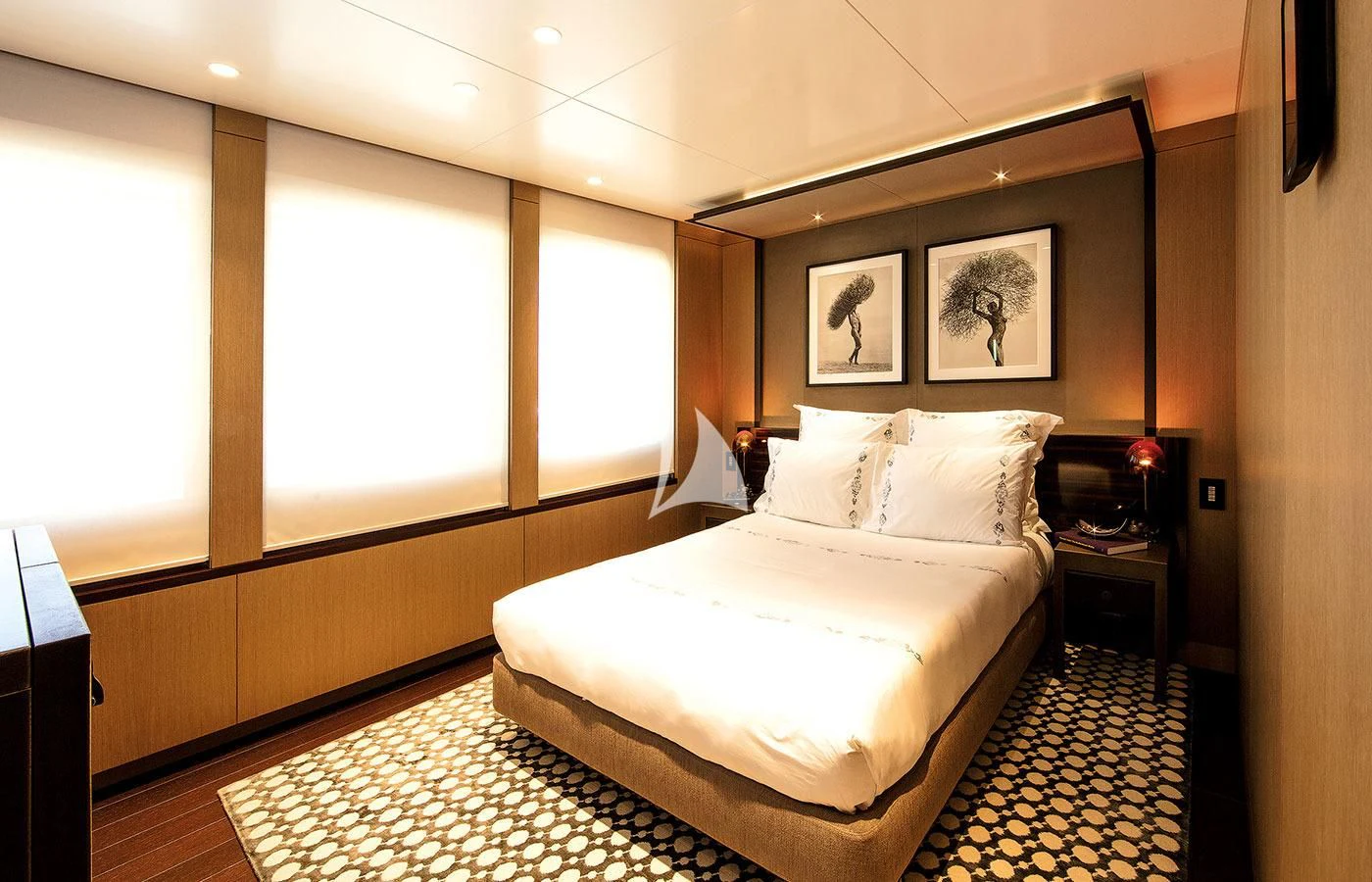 a bedroom with a large bed aboard HALO Yacht for Charter