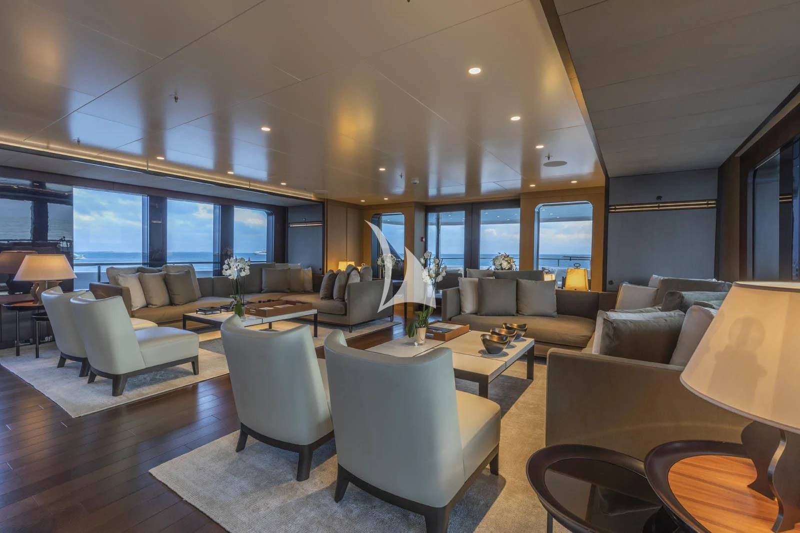 a living room with a large window aboard HALO Yacht for Charter