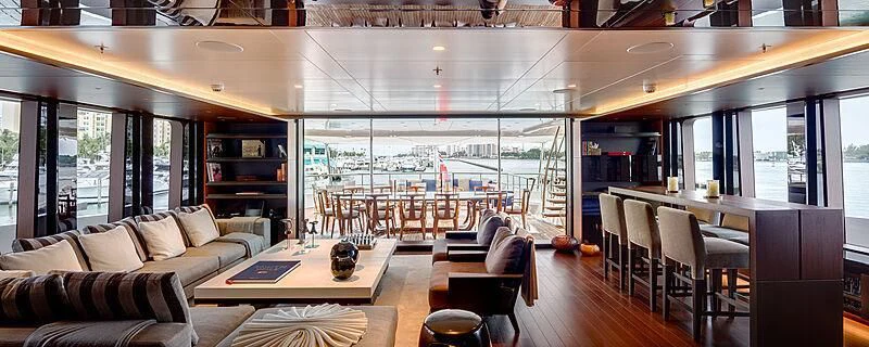 a living room with a large window aboard HALO Yacht for Charter