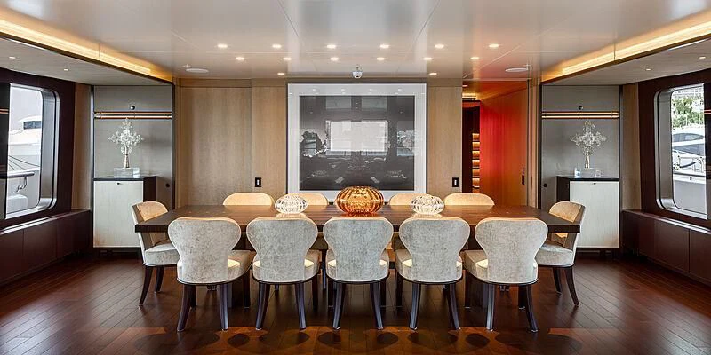 a large dining room with a large table and chairs aboard HALO Yacht for Charter