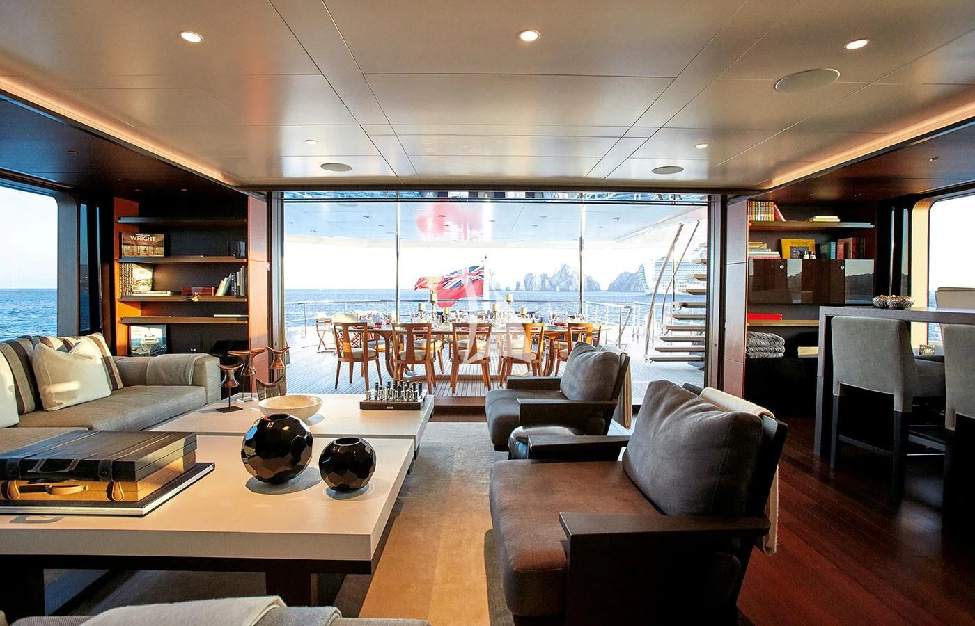 a living room with a large glass window aboard HALO Yacht for Charter