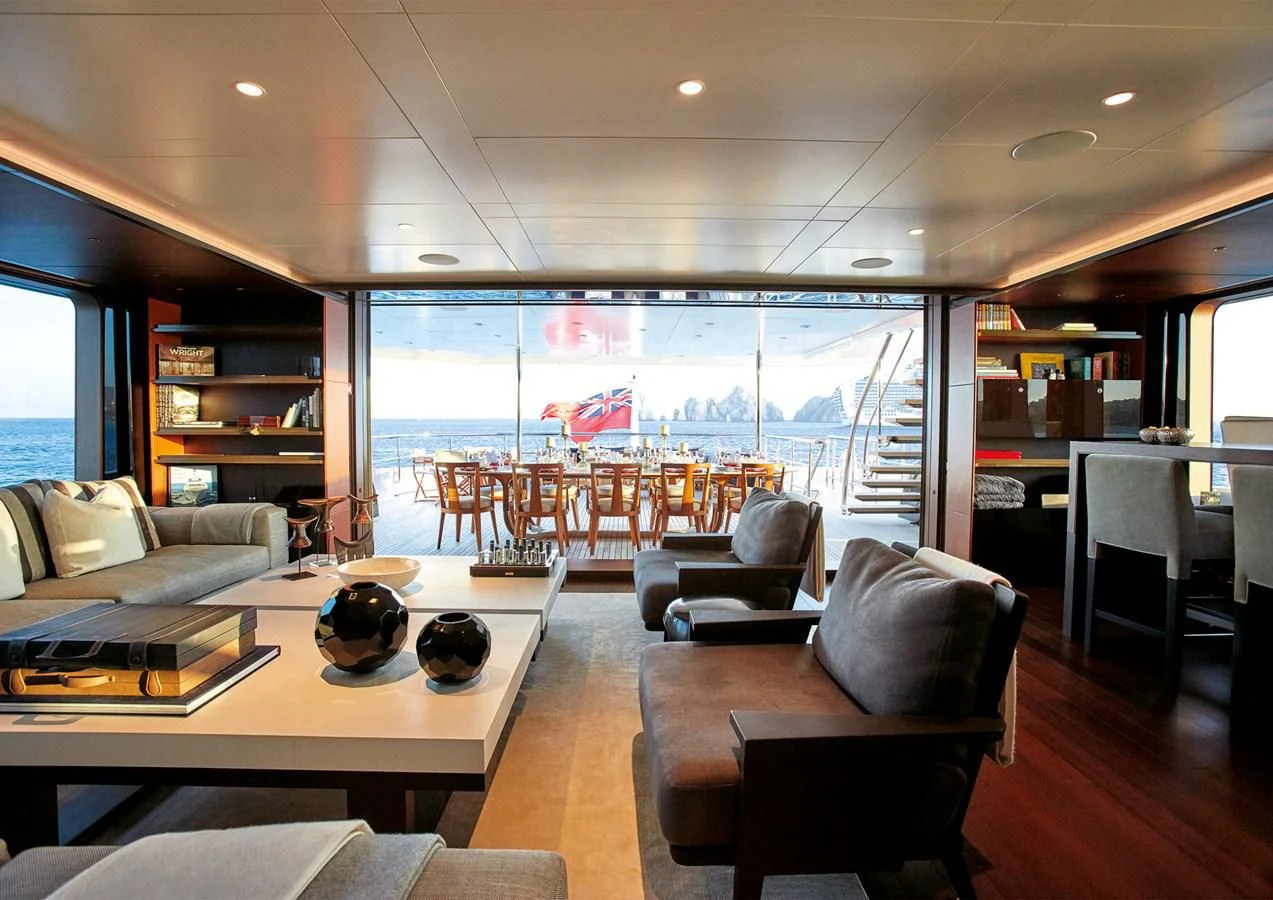 a living room with a large window aboard HALO Yacht for Charter