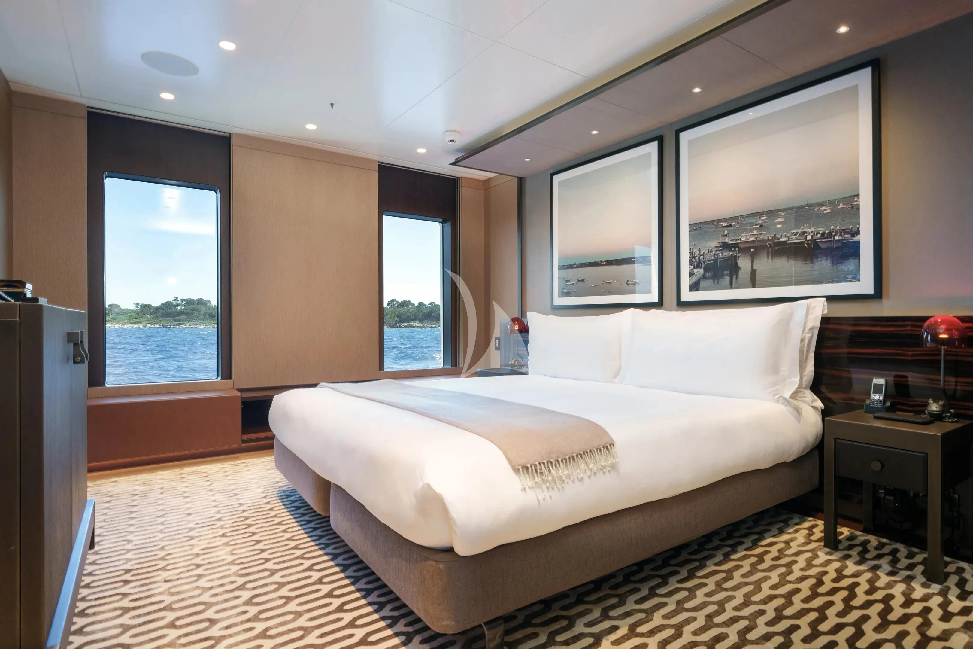 a large bed in a room aboard HALO Yacht for Charter