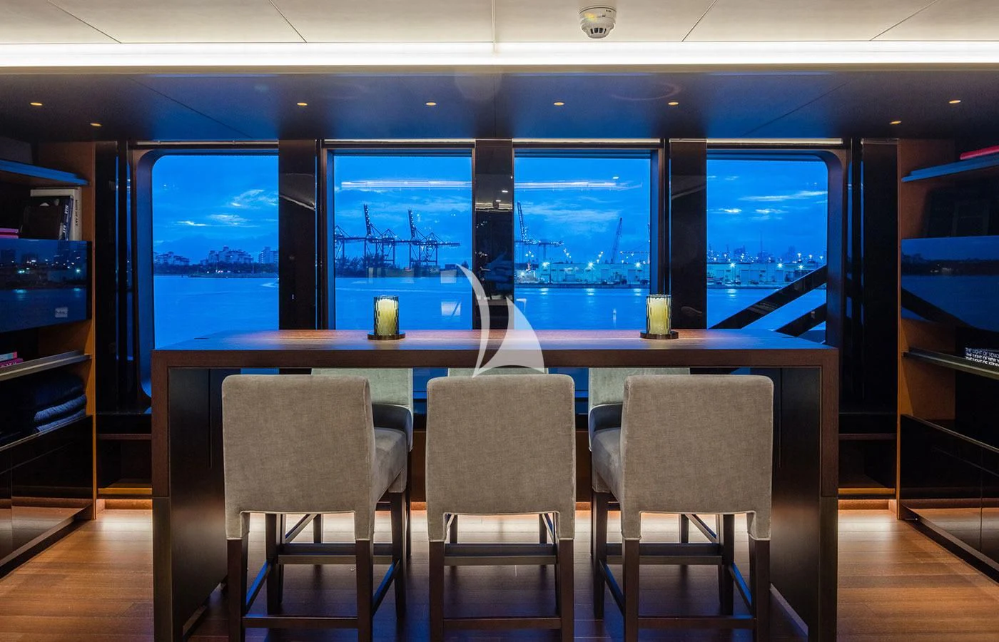 a table and chairs in a room aboard HALO Yacht for Charter
