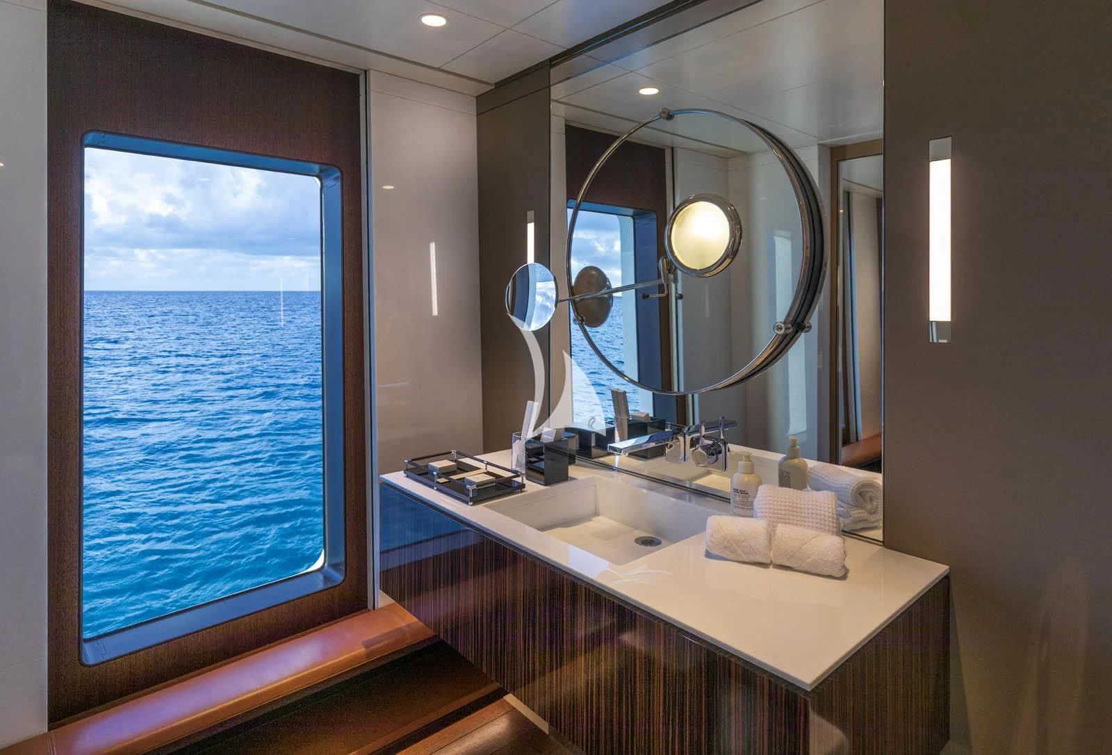 a bathroom with a large window aboard HALO Yacht for Charter