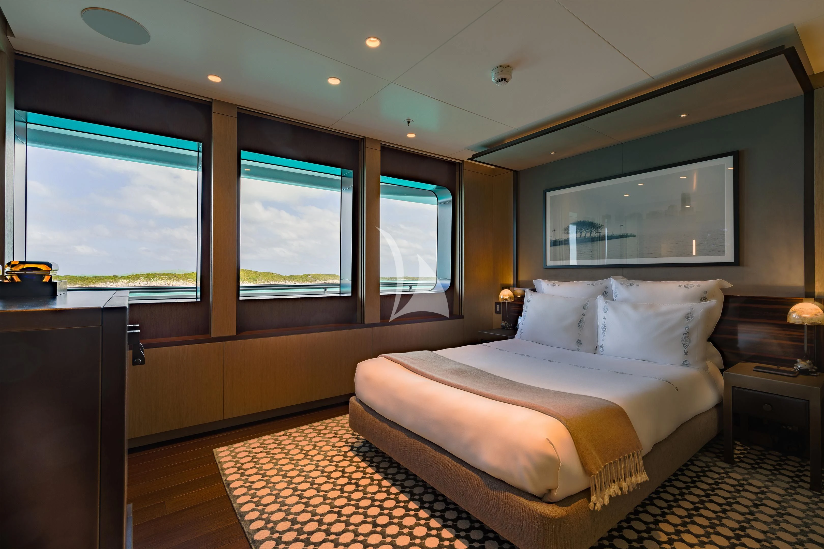 a bedroom with a large bed aboard HALO Yacht for Charter