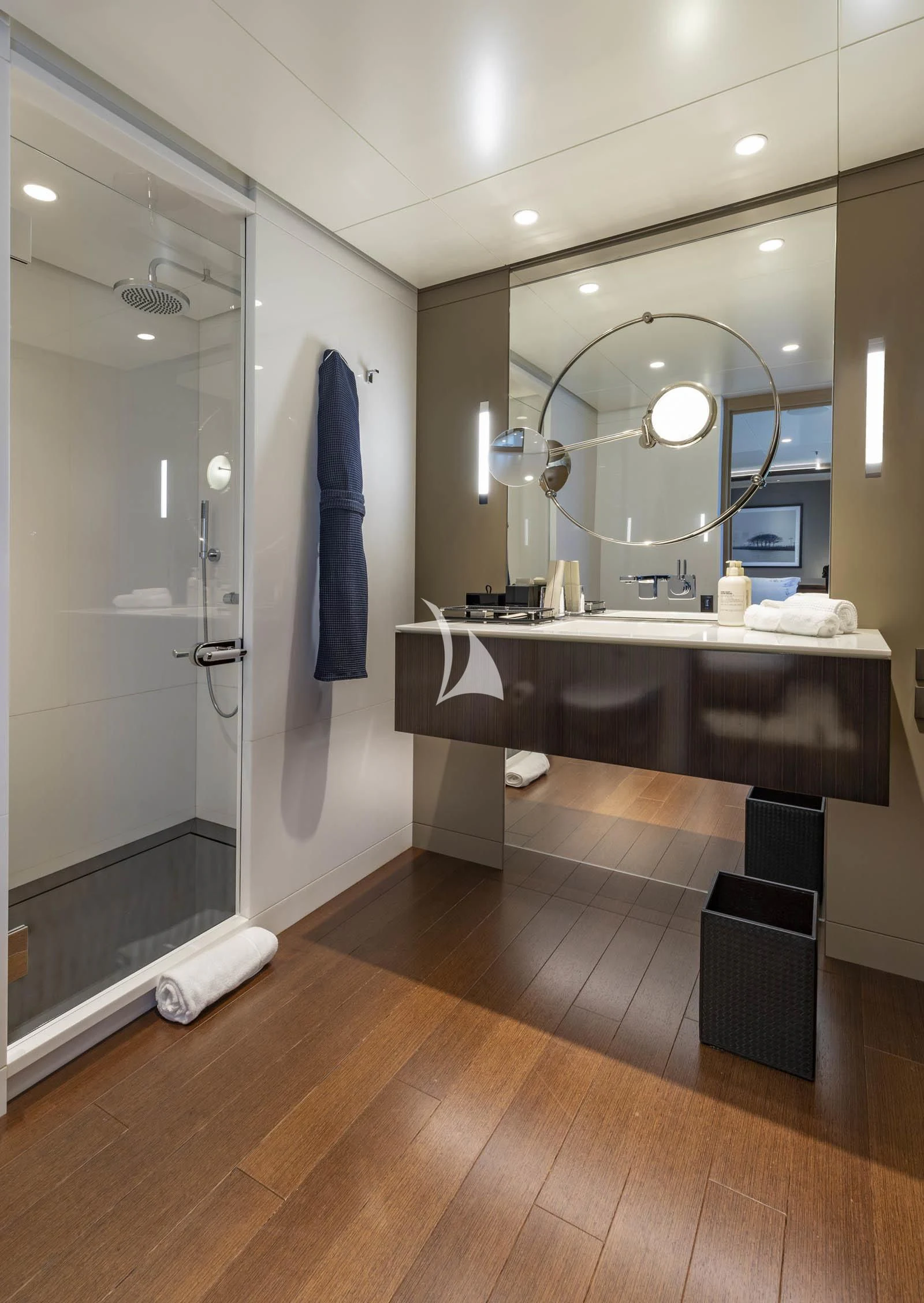 a bathroom with a large mirror aboard HALO Yacht for Charter