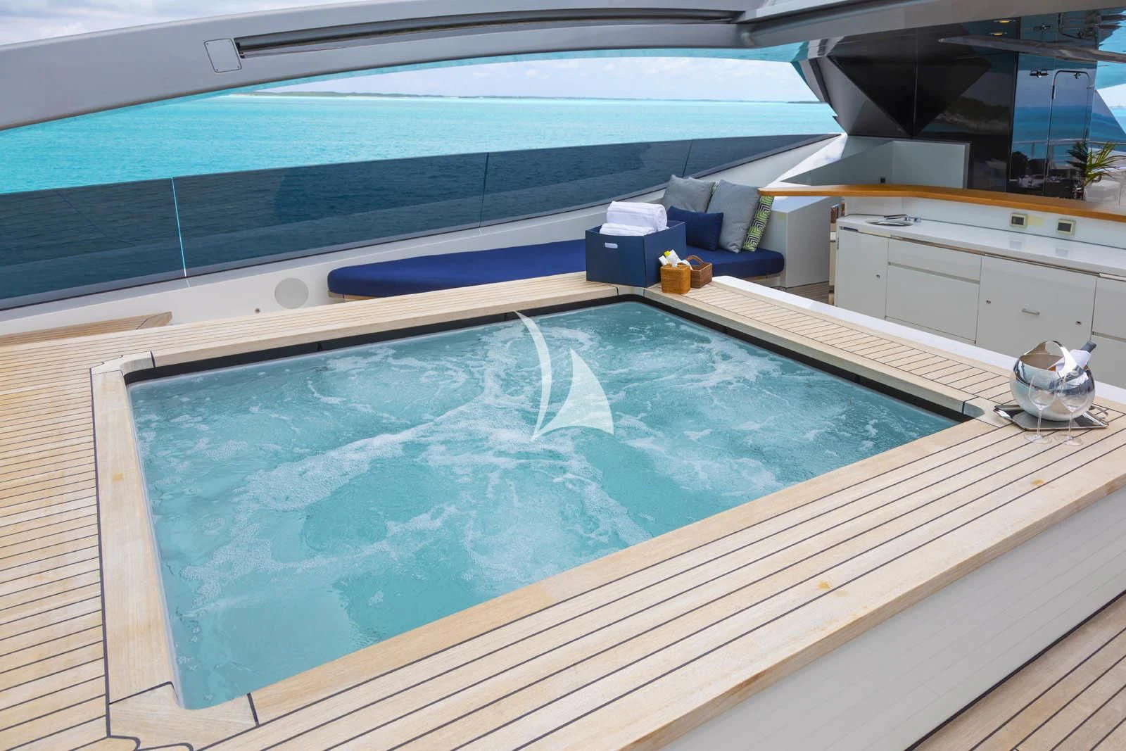 a large kitchen with a large island aboard HALO Yacht for Charter