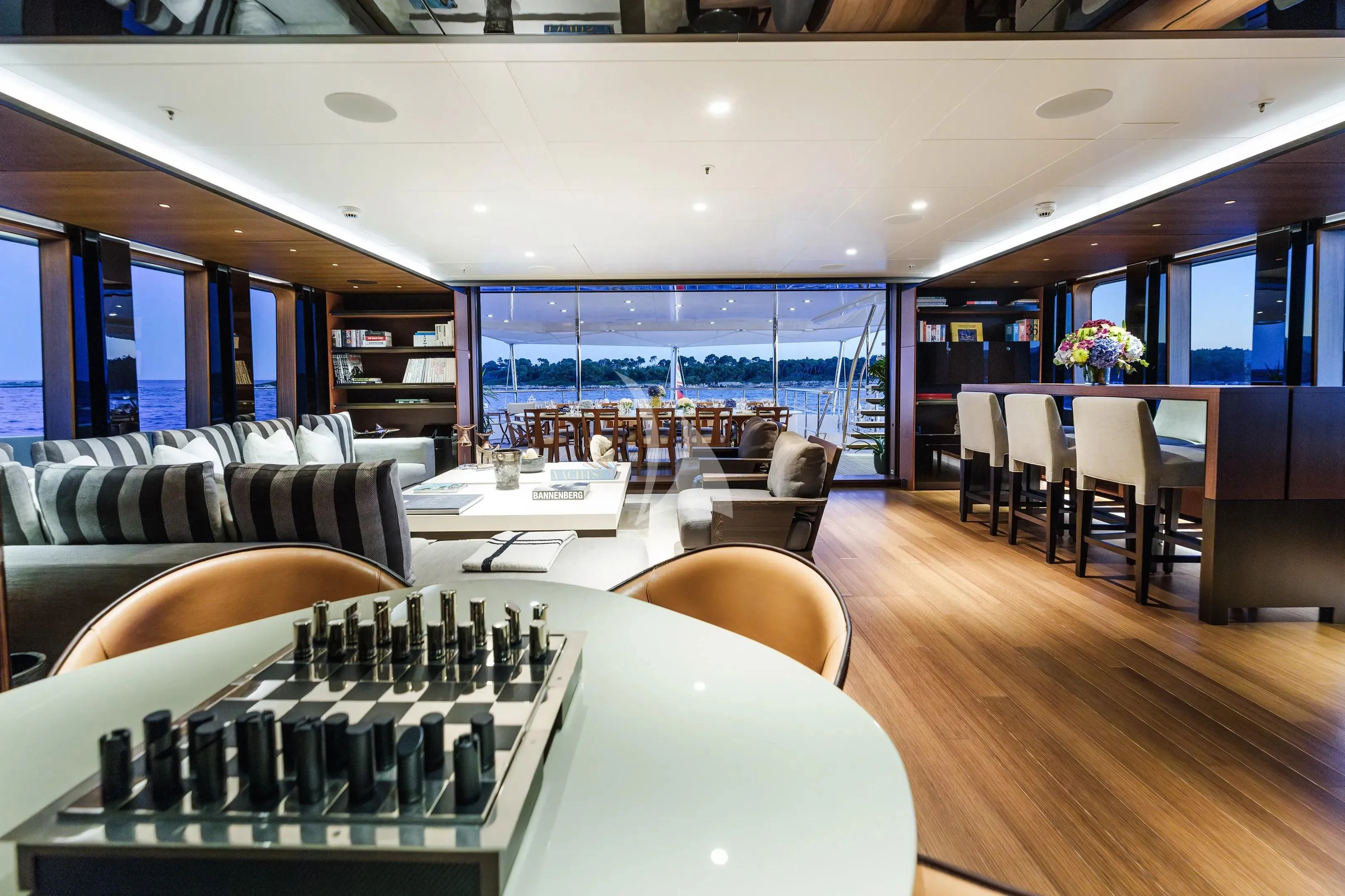 a room with a table and chairs aboard HALO Yacht for Charter