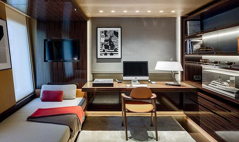 a room with a desk and a bed aboard HALO Yacht for Charter