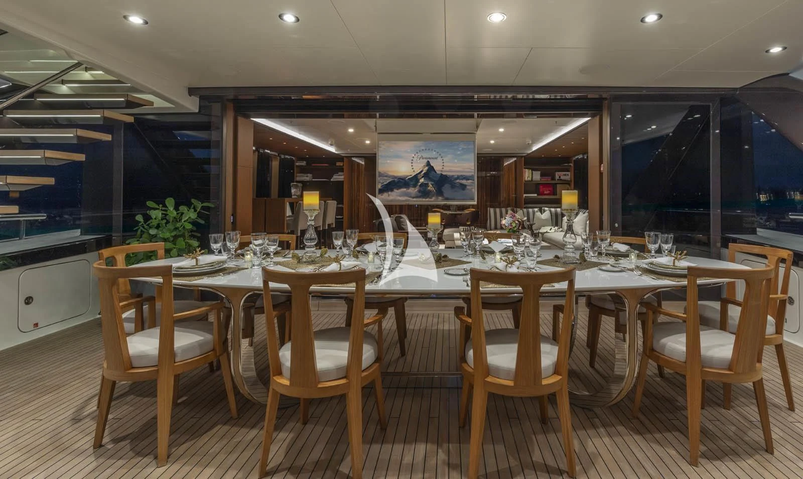 a dining table set for a dinner party aboard HALO Yacht for Charter