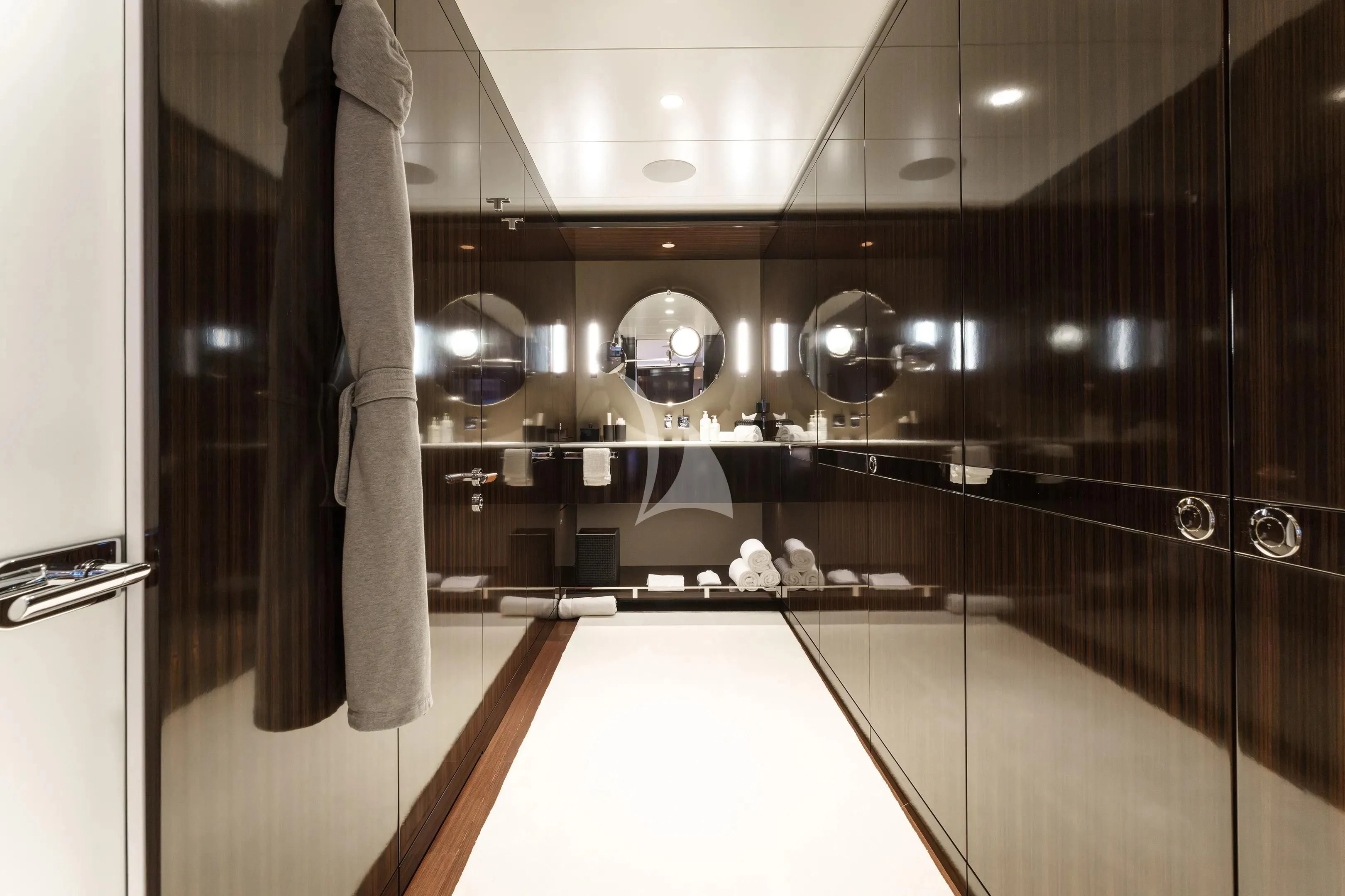 a bathroom with a large mirror aboard HALO Yacht for Charter
