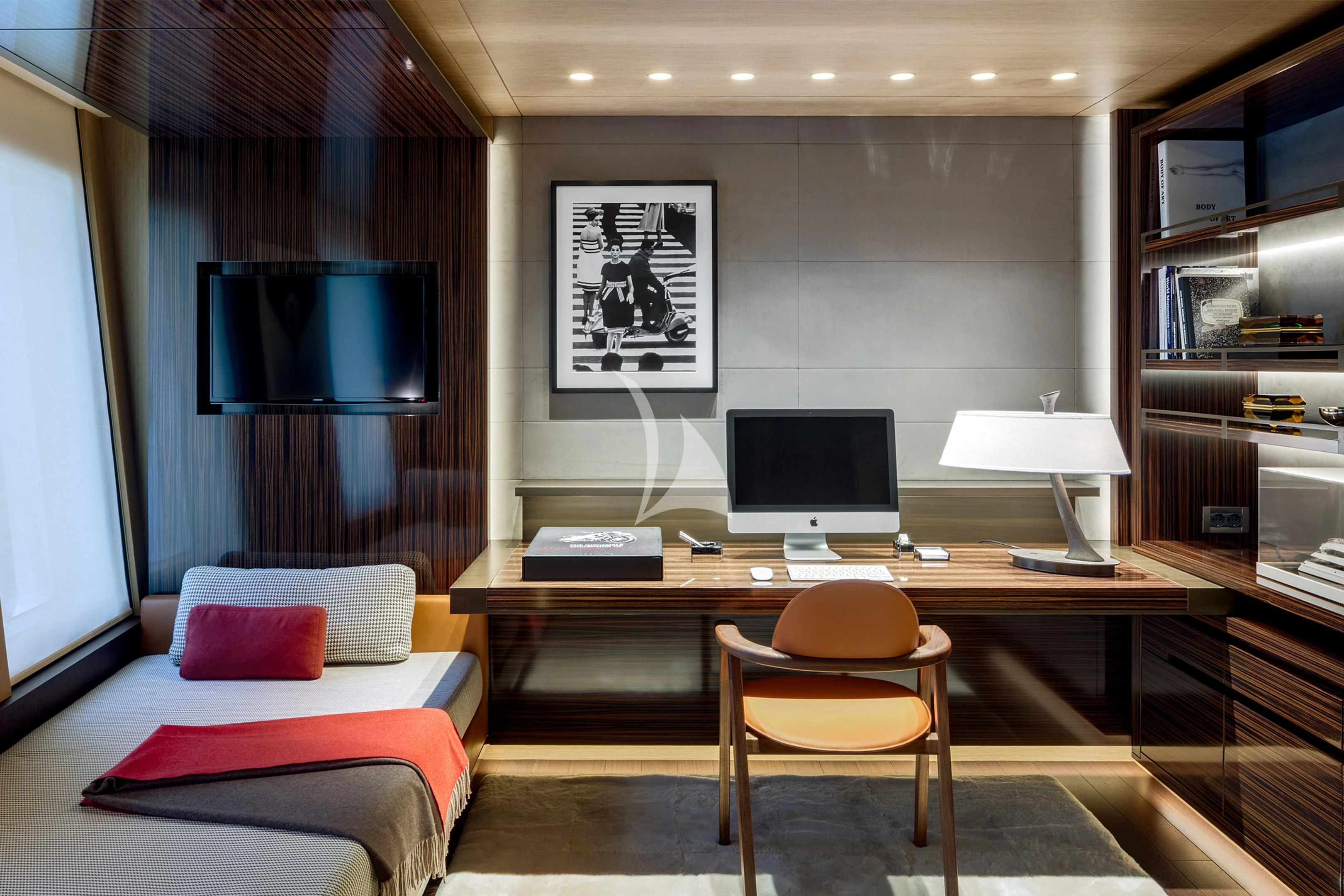 a room with a desk and a bed aboard HALO Yacht for Charter