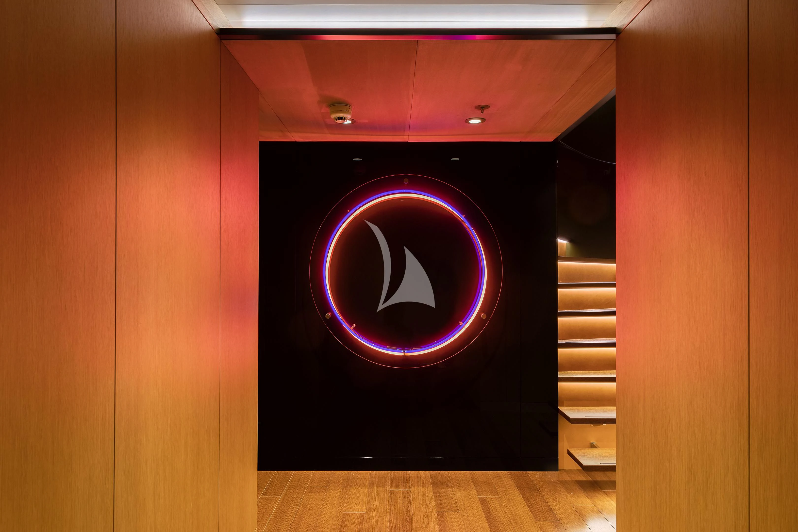 a red circular object with a black symbol on it aboard HALO Yacht for Charter