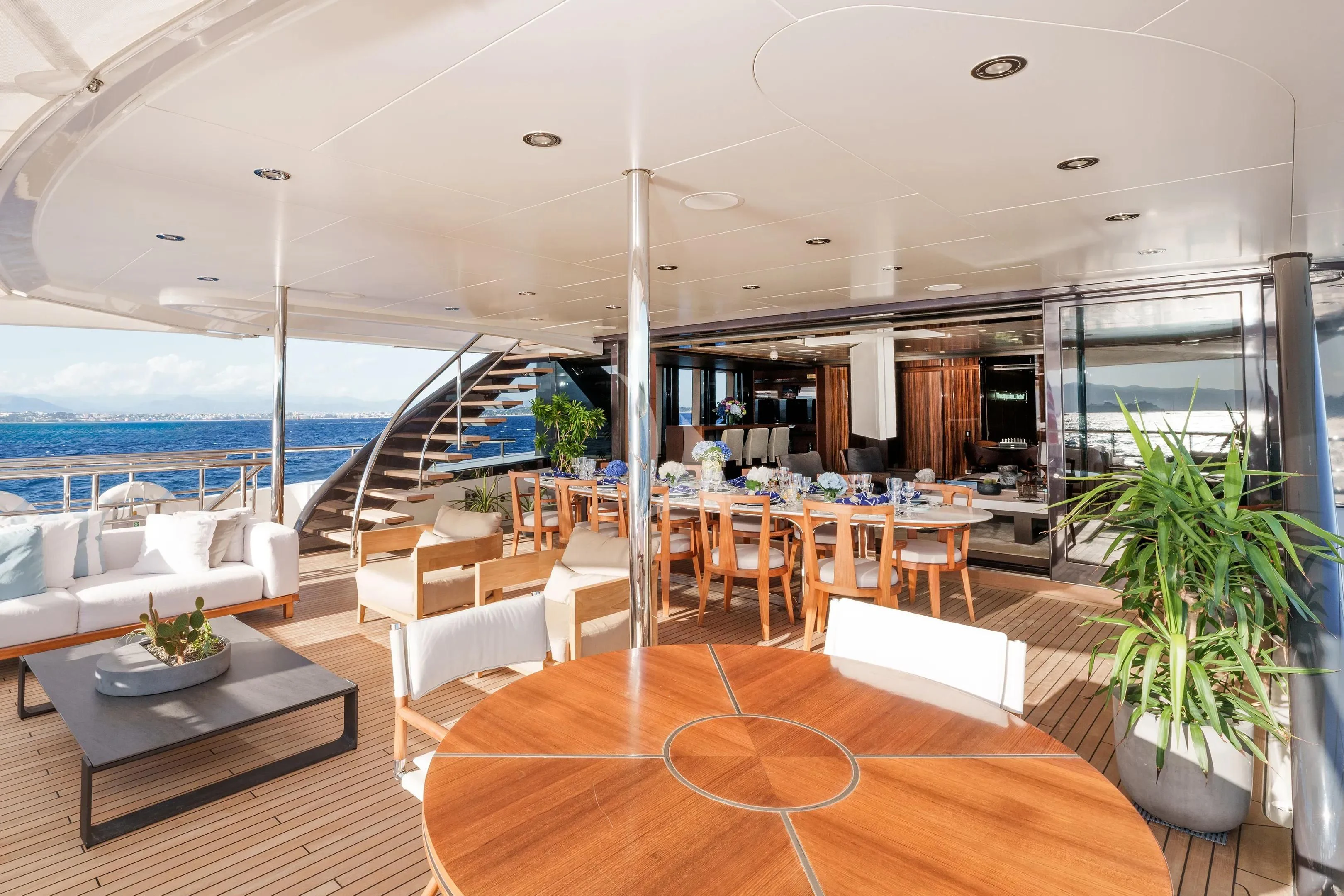 a room with a table and chairs aboard HALO Yacht for Charter