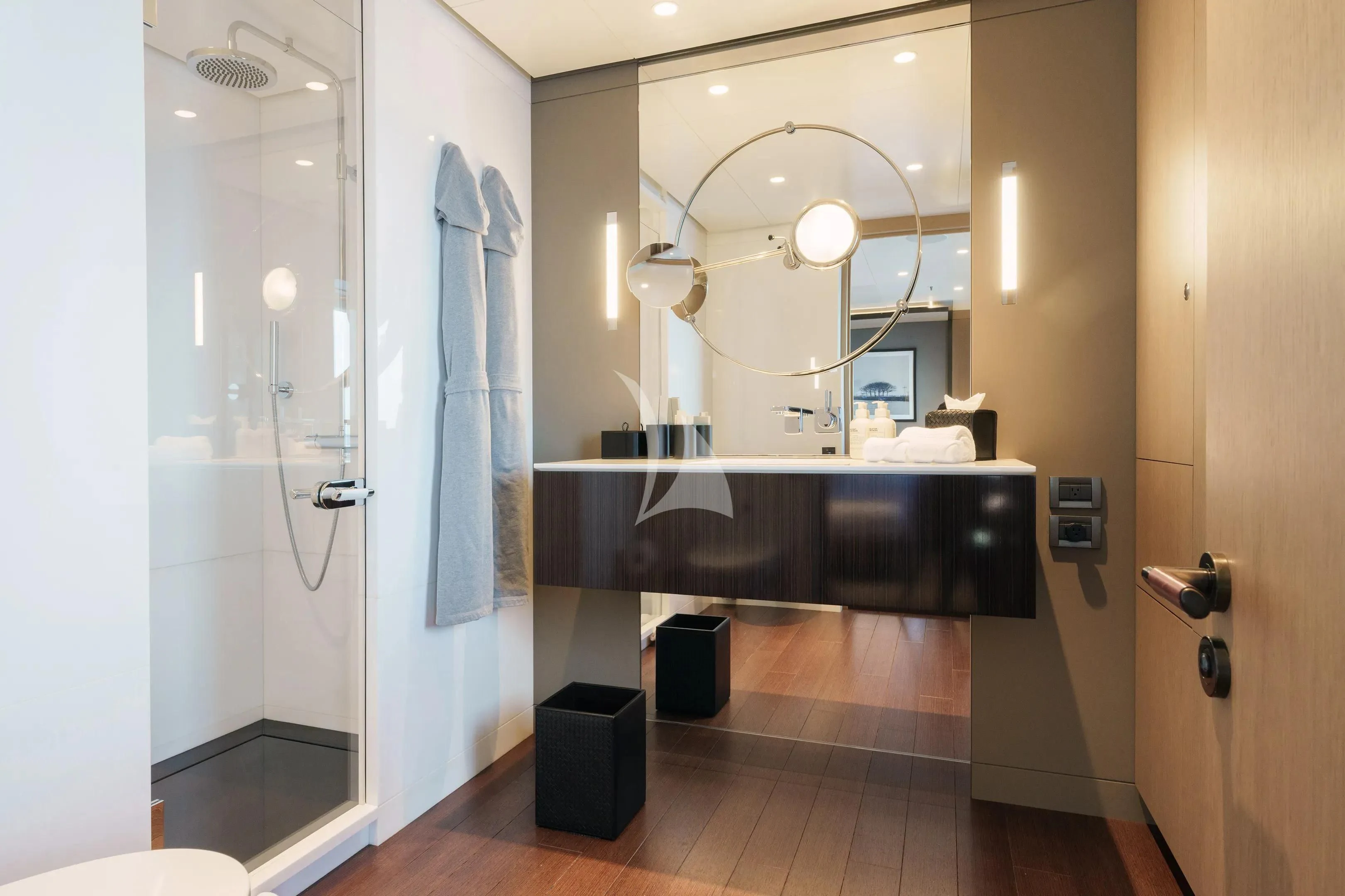 a bathroom with a large mirror aboard HALO Yacht for Charter