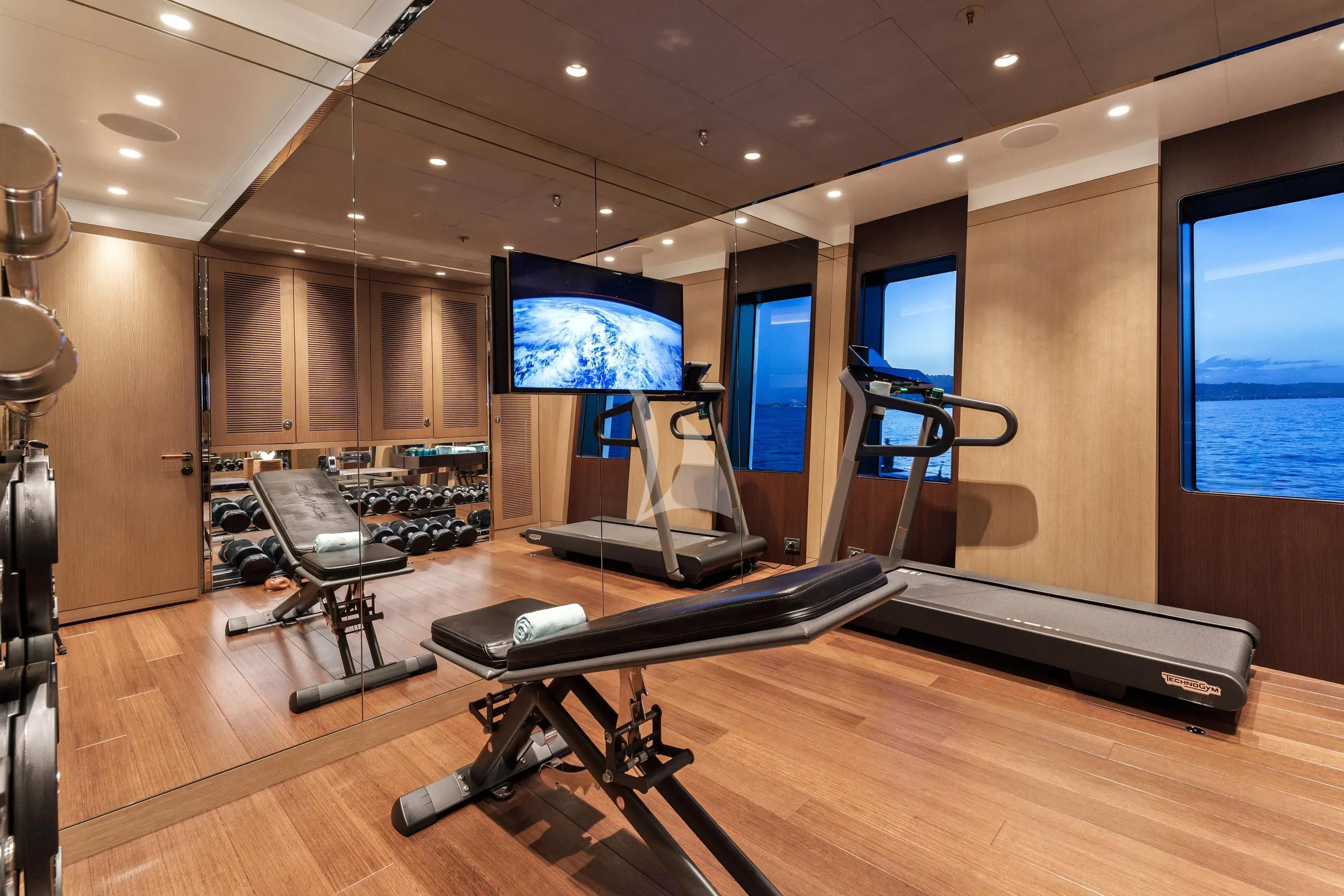 a room with a large screen aboard HALO Yacht for Charter