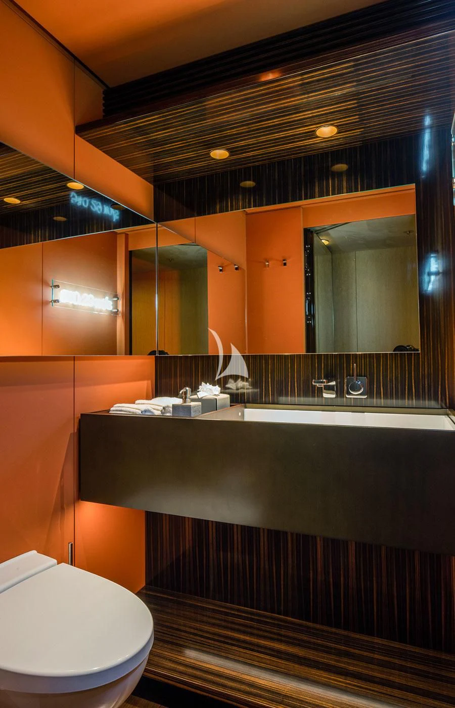 a bathroom with a large mirror aboard HALO Yacht for Charter