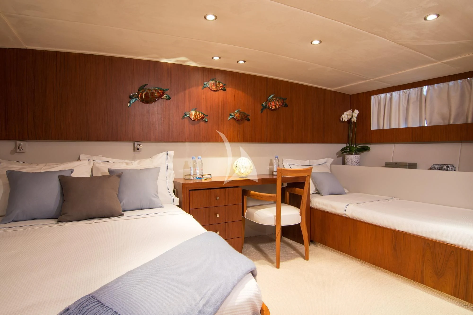 a room with a bed and a desk aboard OCEANE II Yacht for Sale
