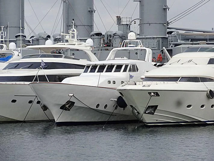 several white yachts in a harbor aboard OCEANE II Yacht for Sale
