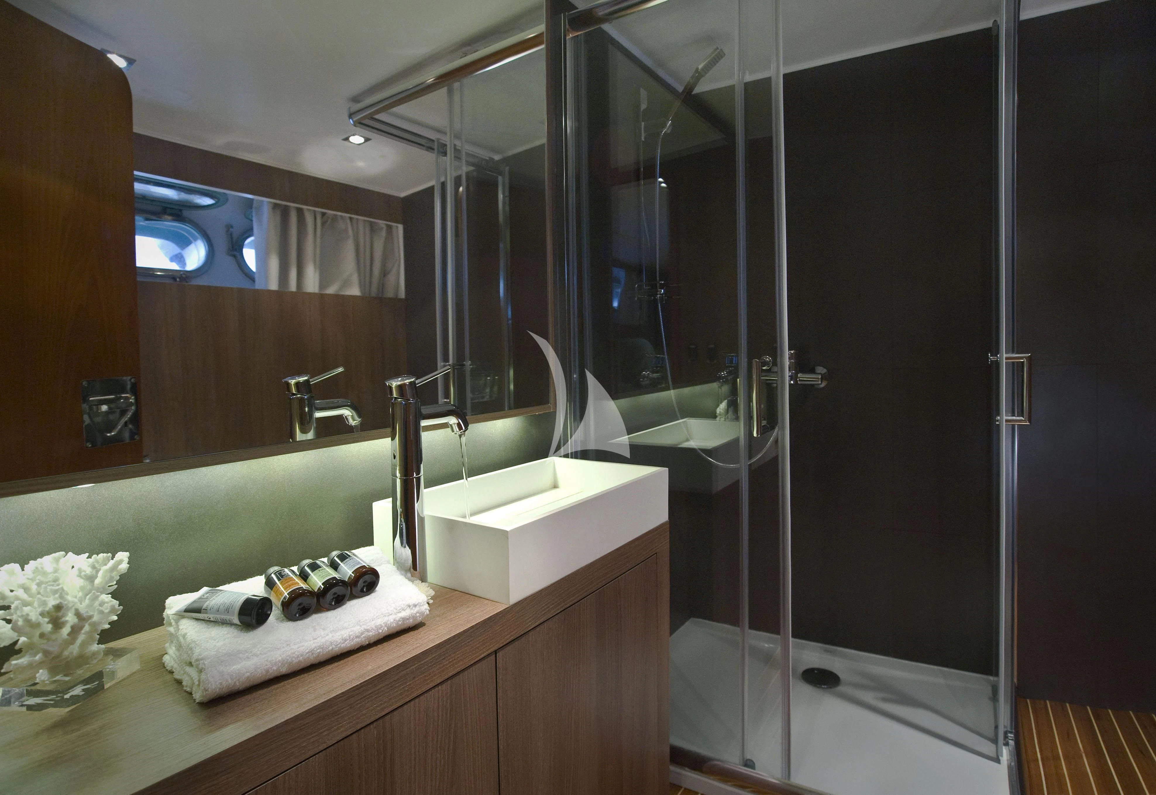 a bathroom with a large glass shower aboard OCEANE II Yacht for Sale