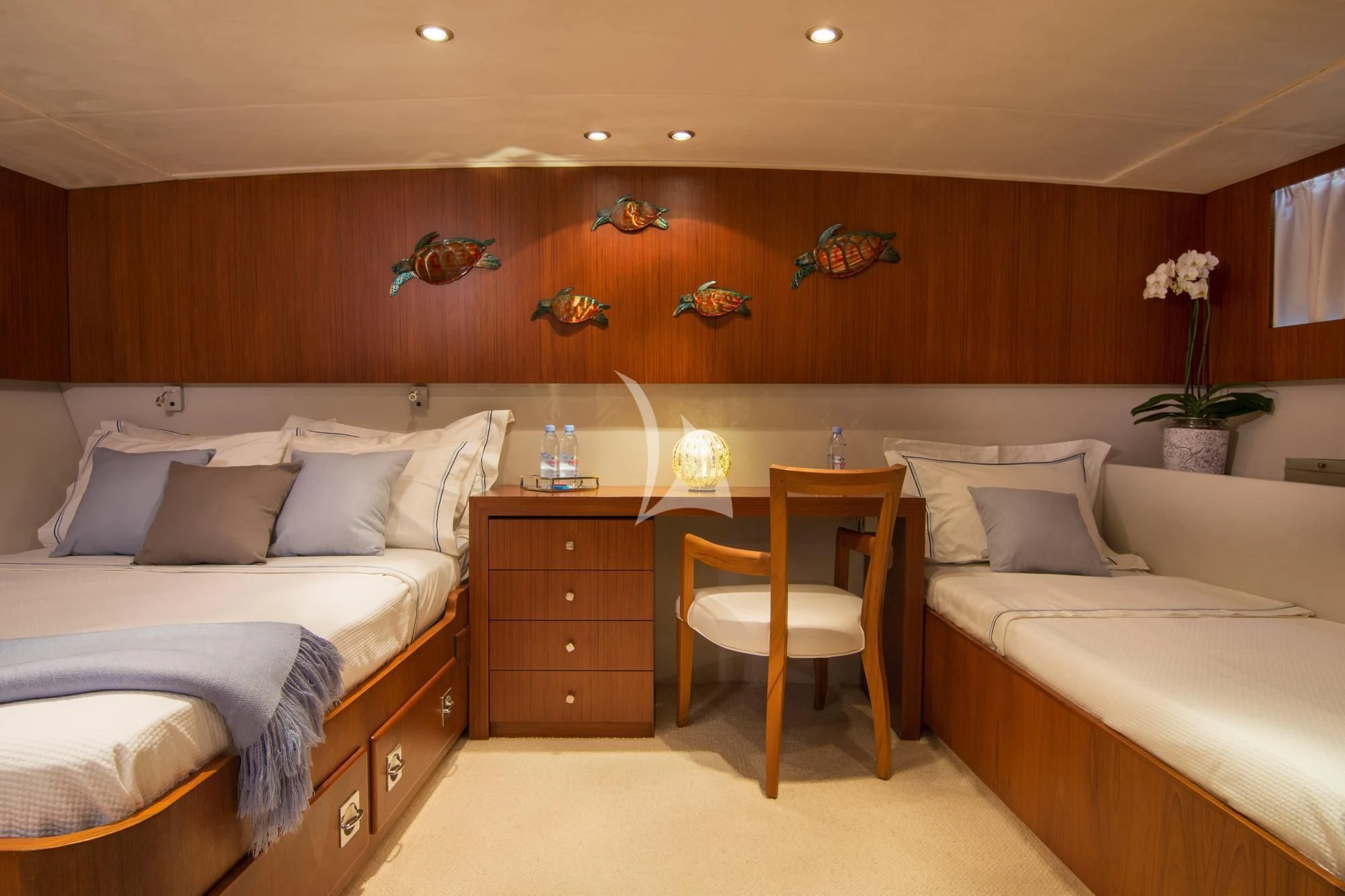 a room with a bed and a desk aboard OCEANE II Yacht for Sale