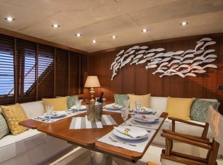 a living room with a couch and a table aboard OCEANE II Yacht for Sale