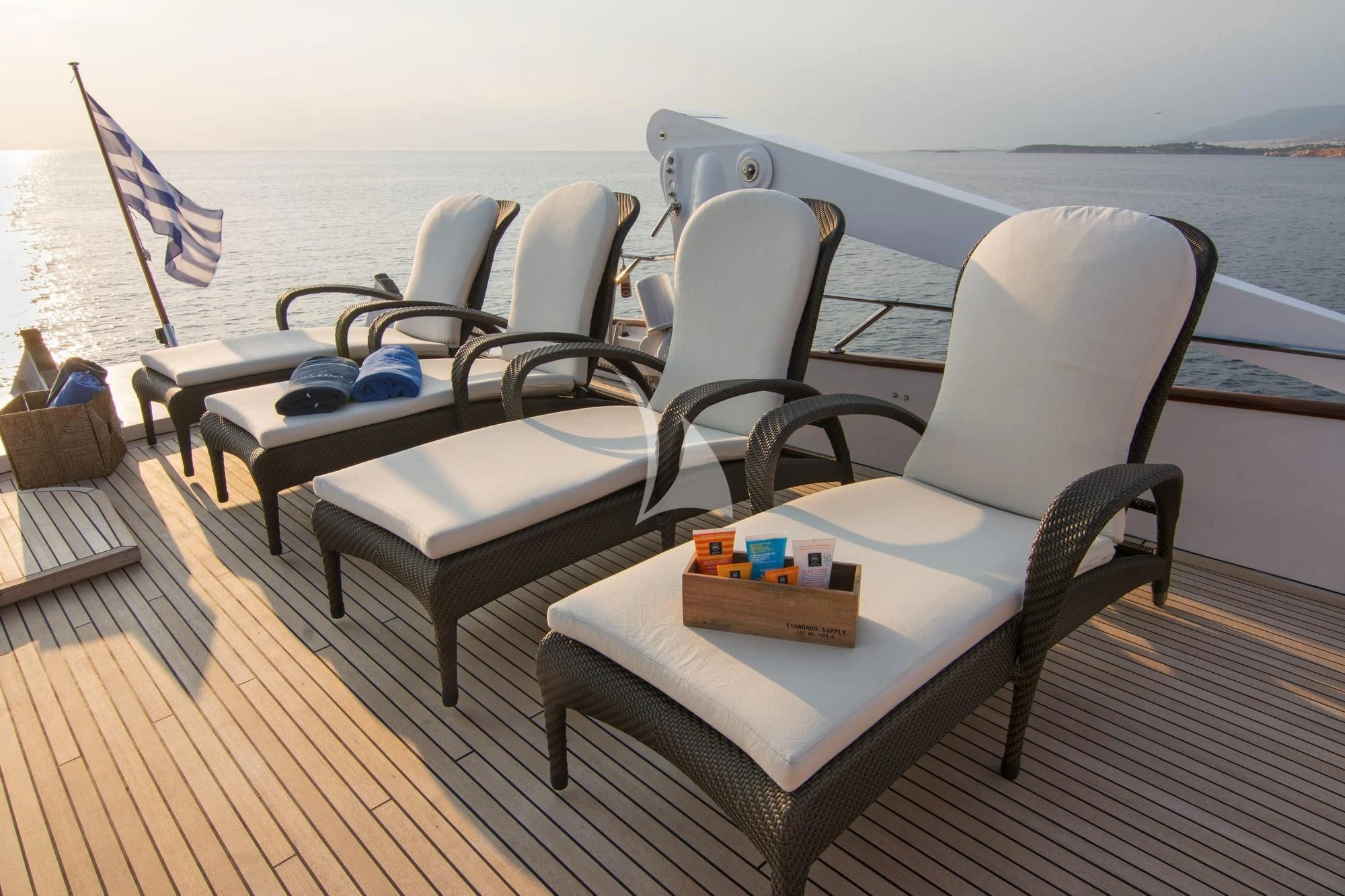 a deck with chairs and a table on it aboard OCEANE II Yacht for Sale